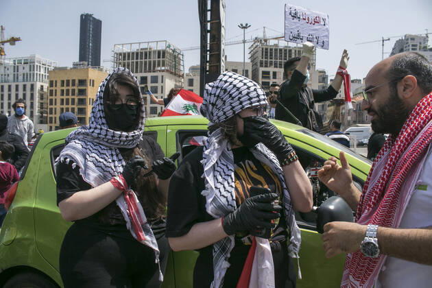 April 22, 2020, Beirut, Lebanon: Protesters wearing protective masks demonstrate in Martyr s Square, Beirut in a convoy of cars with drivers honking their horns, waving the Lebanese national flag and leaning out of the car windows to protest against the deteriorating living conditions exacerbated since the government imposed lockdown measures to combat the spread of COVID-19 coronavirus..Where: Beirut, Lebanon.When: 22 Apr 2020.Credit: Amer GhazzalCover Images Beirut Lebanon - ZUMAc218 20200422_zia_c218_023 Copyright: xCOVERxImagesx