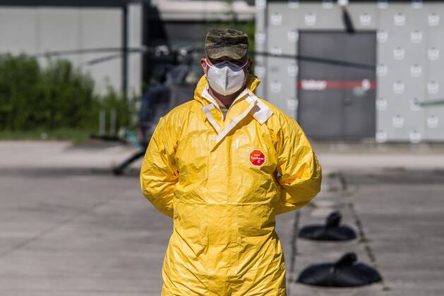 April 22, 2020, Neubiberg Bei Muenchen, Bavaria, Germany: German Bundeswehr soldiers wear gas masks and Dupint TyChem C protective clothing while mixing the constituents together to make Oxicide, a surface disinfectant used in the fight against Coronavirus. At the Bundeswehr Universitaet (Military University of Germany) in Neubiberg near Munich, Bavarian Interior Minister Joachim Herrmann, Generalleutnant Martin Schelleis, dem Nationalen Territorialen Befehlshaber und Inspekteur der Streitkro¤ftebasis, as well as members of the Technisches Hilfswerk (Federal Agency for Technical Relief) were on hand to explain the effort and coordination of the production of large amounts of surface disinfectants used to help in the fight against SARS-CoV-2 Coronavirus. Germany is currently at 148,174 positive diagnoses with 4,961 deaths. Neubiberg Be - ZUMAb160 20200422_zbp_b160_009 Copyright: xSachellexBabbarx