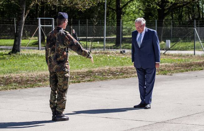 April 22, 2020, Neubiberg Bei Muenchen, Bavaria, Germany: JOACHIM HERRMANN, Interior Minister of Bavaria and Generalleutnant MARTIN SCHELLEIS of the German Bundeswehr (Military) discussing the efforts of military personnel in manufacturing large volumes of disinfectants used to fight the spread of the SARS-CoV-2 Coronavirus. At the Bundeswehr Universitaet (Military University of Germany) in Neubiberg near Munich, Bavarian Interior Minister Joachim Herrmann, Generalleutnant Martin Schelleis, dem Nationalen Territorialen Befehlshaber und Inspekteur der StreitkroÂ¤ftebasis, as well as members of the Technisches Hilfswerk (Federal Agency for Technical Relief) were on hand to explain the effort and coordination of the production of large amounts of surface disinfectants used to help in the fight against SARS-CoV-2 Coronavirus. Germany is cur - ZUMAb160 20200422_zbp_b160_012 Copyright: xSachellexBabbarx