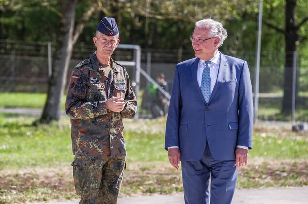 April 22, 2020, Neubiberg Bei Muenchen, Bavaria, Germany: JOACHIM HERRMANN, Interior Minister of Bavaria and Generalleutnant MARTIN SCHELLEIS of the German Bundeswehr (Military) discussing the efforts of military personnel in manufacturing large volumes of disinfectants used to fight the spread of the SARS-CoV-2 Coronavirus. At the Bundeswehr Universitaet (Military University of Germany) in Neubiberg near Munich, Bavarian Interior Minister Joachim Herrmann, Generalleutnant Martin Schelleis, dem Nationalen Territorialen Befehlshaber und Inspekteur der StreitkroÂ¤ftebasis, as well as members of the Technisches Hilfswerk (Federal Agency for Technical Relief) were on hand to explain the effort and coordination of the production of large amounts of surface disinfectants used to help in the fight against SARS-CoV-2 Coronavirus. Germany is cur - ZUMAb160 20200422_zbp_b160_015 Copyright: xSachellexBabbarx