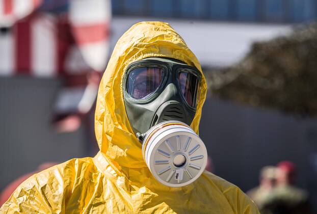 April 22, 2020, Neubiberg Bei Muenchen, Bavaria, Germany: German Bundeswehr soldiers wear gas masks and Dupint TyChem C protective clothing while mixing the constituents together to make Oxicide, a surface disinfectant used in the fight against Coronavirus. At the Bundeswehr Universitaet (Military University of Germany) in Neubiberg near Munich, Bavarian Interior Minister Joachim Herrmann, Generalleutnant Martin Schelleis, dem Nationalen Territorialen Befehlshaber und Inspekteur der Streitkro¤ftebasis, as well as members of the Technisches Hilfswerk (Federal Agency for Technical Relief) were on hand to explain the effort and coordination of the production of large amounts of surface disinfectants used to help in the fight against SARS-CoV-2 Coronavirus. Germany is currently at 148,174 positive diagnoses with 4,961 deaths. Neubiberg Be - ZUMAb160 20200422_zbp_b160_064 Copyright: xSachellexBabbarx