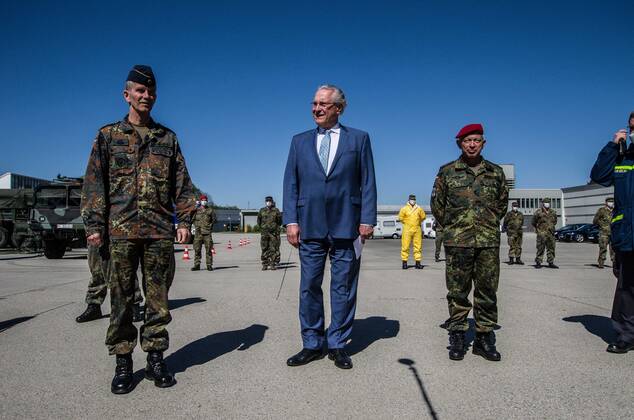 April 22, 2020, Neubiberg Bei Muenchen, Bavaria, Germany: JOACHIM HERRMANN, Interior Minister of Bavaria and Generalleutnant MARTIN SCHELLEIS of the German Bundeswehr (Military) discussing the efforts of military personnel in manufacturing large volumes of disinfectants used to fight the spread of the SARS-CoV-2 Coronavirus. At the Bundeswehr Universitaet (Military University of Germany) in Neubiberg near Munich, Bavarian Interior Minister Joachim Herrmann, Generalleutnant Martin Schelleis, dem Nationalen Territorialen Befehlshaber und Inspekteur der StreitkroÂ¤ftebasis, as well as members of the Technisches Hilfswerk (Federal Agency for Technical Relief) were on hand to explain the effort and coordination of the production of large amounts of surface disinfectants used to help in the fight against SARS-CoV-2 Coronavirus. Germany is cur - ZUMAb160 20200422_zbp_b160_075 Copyright: xSachellexBabbarx