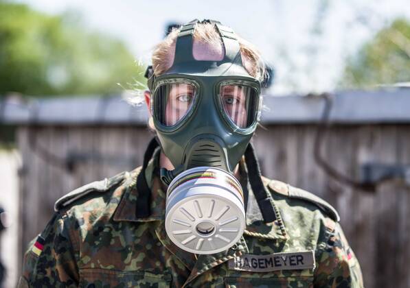 April 22, 2020, Neubiberg Bei Muenchen, Bavaria, Germany: German Bundeswehr soldiers wear gas masks and Dupint TyChem C protective clothing while mixing the constituents together to make Oxicide, a surface disinfectant used in the fight against Coronavirus. At the Bundeswehr Universitaet (Military University of Germany) in Neubiberg near Munich. Germany is currently at 148,174 positive diagnoses with 4,961 deaths. Neubiberg Bei Muenchen Germany - ZUMAb160 20200422_zbp_b160_059 Copyright: xSachellexBabbarx