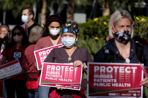 April 22, 2020, Los Angeles, California, U.S: Nurses take part in silent march outside Kaiser Permanente in Los Angeles. Nurses exposing Kaiser Permanente for lack of preparedness, lack of PPE, retaliation against nurses for advocation, not providing appropriate benefits when exposed or tested positive with COVID-19. Los Angeles USA - ZUMAc68_ 20200422_zaf_c68_008 Copyright: xRingoxChiux