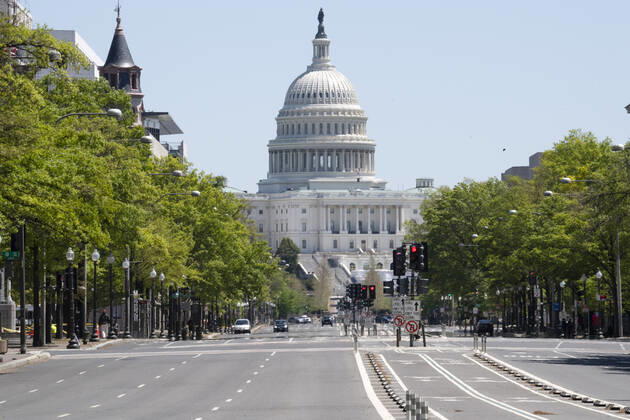 Pennsylvania Avenue that runs between the White House to the U.S. Capitol is empty during the normal business lunch hour on Wednesday, April 22, 2020 in Washington, DC. Office buildings, retail stores and restaurants are essentially closed in the Nation s Capital due to COVID-19. Depending on how long the shutdown will last, some say 30% to 50% of the DC restaurants and bars will not be able to reopen.  WAS2020042201 PATxBENIC