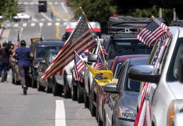 April 22, 2020, Los Angeles, California, U.S: Demonstrators take part a vehicle caravan protest to call on state and local officials to re-open the economy during the coronavirus disease outbreak in downtown Los Angeles, Wednesday April 22, 2020. Los Angeles U.S. - ZUMAc68_ 20200422_zaf_c68_020 Copyright: xRingoxChiux