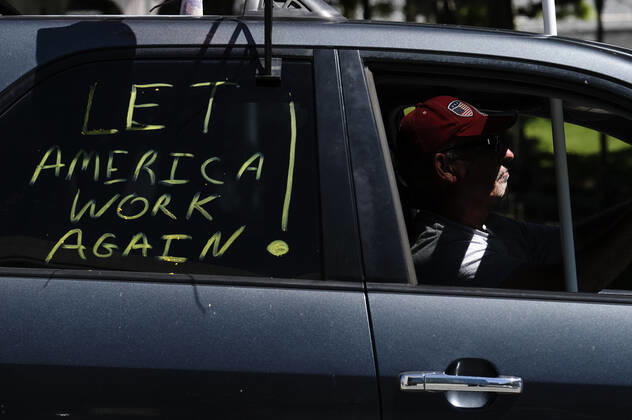 April 22, 2020, Los Angeles, California, U.S: A demonstrator takes part a vehicle caravan protest to call on state and local officials to re-open the economy during the coronavirus disease outbreak in downtown Los Angeles, Wednesday April 22, 2020. Los Angeles U.S. - ZUMAc68_ 20200422_zaf_c68_023 Copyright: xRingoxChiux
