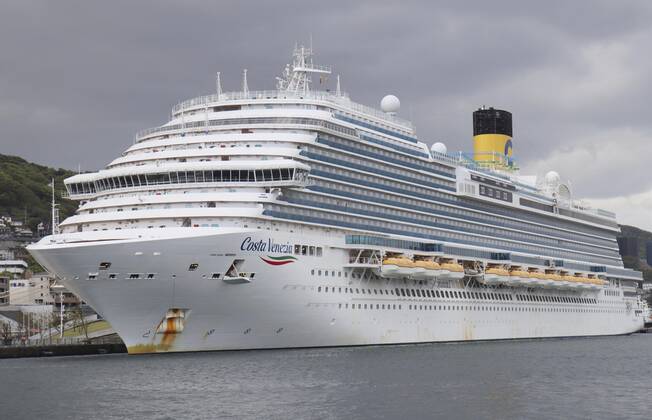 Costa Venezia cruise ship Photo taken April 23, 2020, shows the Costa Venezia cruise ship docked at a port in Nagasaki to refuel and restock food. On the Costa Atlantica, another cruise ship docked in the same southwestern Japan city, 48 of 623 crew members have tested positive for the new coronavirus. 