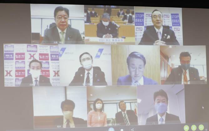 New coronavirus Photo taken in Tokyo on April 23, 2020, shows a videoconference Japanese economic revitalization minister Yasutoshi Nishimura (R, bottom of screen) is holding with a group of governors from around the country to discuss measures against the new coronavirus. 