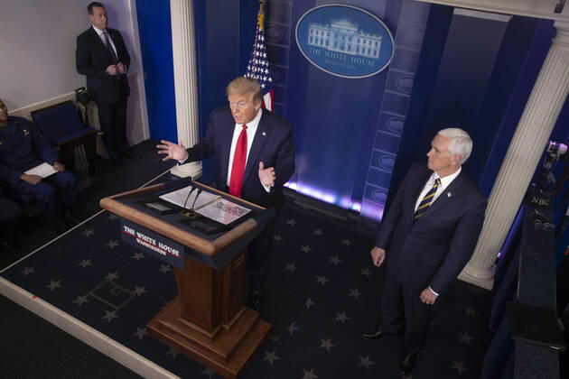President Donald J. Trump (C) speaks as the Coronavirus Task Force delivers remarks on the COVID-19 pandemic in the James S. Brady Press Briefing Room of the White House in Washington, DC, on April 22, 2020.  WAX20200422910 MICHAELxREYNOLDS