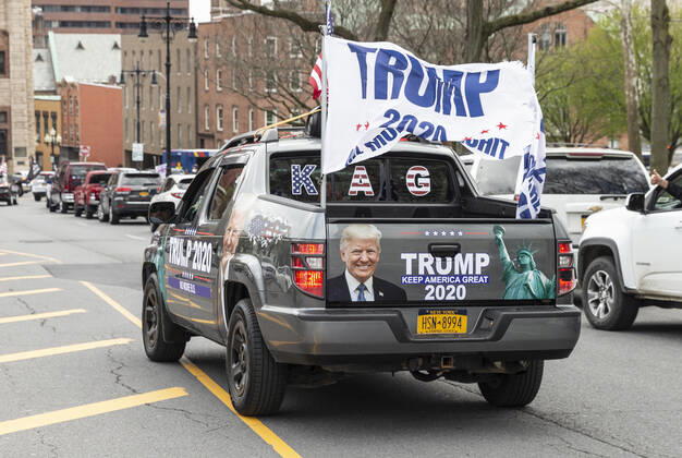 NY: Operation Gridlock in Albany People in cars and on streets with American flags and Trump flags participate in Operation Gridlock protest outside of New York State Capitol Building. Participants demanded reopening of New York State. Many people on the street disregarded wearing facial masks and keep social distances. Albany New York United States Copyright: LevxRadin