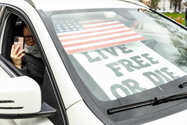 NY: Operation Gridlock in Albany People in cars and on streets with American flags and Trump flags participate in Operation Gridlock protest outside of New York State Capitol Building. Participants demanded reopening of New York State. Many people on the street disregarded wearing facial masks and keep social distances. Albany New York United States Copyright: LevxRadin