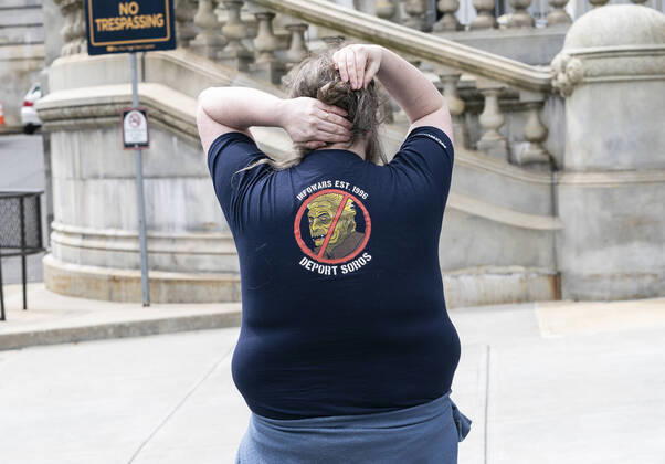 NY: Operation Gridlock in Albany A man wearing infowars.com t-shirt participates in Operation Gridlock protest outside of New York State Capitol Building. Participants demanded reopening of New York State. Many people on the street disregarded wearing facial masks and keep social distances. Albany New York United States Copyright: LevxRadin