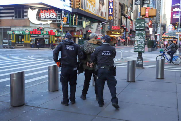 April 22, 2020, New York, New York, United States: A man is detained by police officers after being asked to withdraw from the Port Authority Bus Terminal in Manhattan in New York City. New York City is the epicenter of the Coronavirus pandemic New York United States - ZUMAv122 20200422_zap_v122_086 Copyright: xWilliamxVolcovx