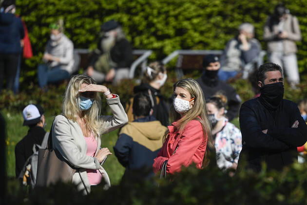 People waiting queue to take a sample for a covid-19 test, on April 23, 2020, in Zitek Gardens, Prague, Czech Republic. Across-the-board testing of population for new coronavirus began today. Test points open in Prague at 10:00, in Brno and Litomerice at 8:00. The goal is to find out the presence of coronavirus in Czech population. (CTKxPhoto MichalxKamaryt) CTKPhotoP202004230320201 kmt 6