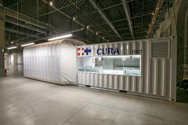 A two-bed intensive care unit within a shipping container has been built at a hospital in Turin and is being used to treat patients fighting the coronavirus. Named Connected Units for Respiratory Ailments (CURA), the intensive care pod was designed by Italian architects Carlo Ratti and Italo Rota to increase intensive care unit (ICU) capacity in northern Italy. The pod, which contains two beds, has been installed at a temporary hospital built within the Officine Grandi Riparazioni complex in central Turin. The first patient was admitted earlier this week on 19 April. Built within a 6.1-metre-long shipping container, the intensive care pod contains beds and facilities including ventilators, monitors, intravenous fluid stands and syringe drivers for two patients. Ratti believes that the shipping-container pods combine the benef Copyright: xx 40462600 EDITORIAL USE ONLY. NOT FOR USE BY NEWSPAPERS BASED IN THE UK.