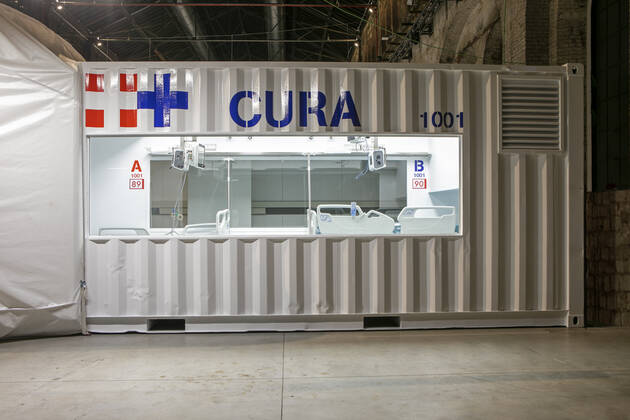 A two-bed intensive care unit within a shipping container has been built at a hospital in Turin and is being used to treat patients fighting the coronavirus. Named Connected Units for Respiratory Ailments (CURA), the intensive care pod was designed by Italian architects Carlo Ratti and Italo Rota to increase intensive care unit (ICU) capacity in northern Italy. The pod, which contains two beds, has been installed at a temporary hospital built within the Officine Grandi Riparazioni complex in central Turin. The first patient was admitted earlier this week on 19 April. Built within a 6.1-metre-long shipping container, the intensive care pod contains beds and facilities including ventilators, monitors, intravenous fluid stands and syringe drivers for two patients. Ratti believes that the shipping-container pods combine the benef Copyright: xx 40462603 EDITORIAL USE ONLY. NOT FOR USE BY NEWSPAPERS BASED IN THE UK.
