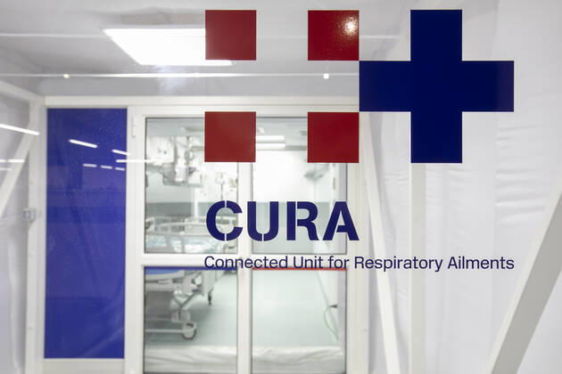 A two-bed intensive care unit within a shipping container has been built at a hospital in Turin and is being used to treat patients fighting the coronavirus. Named Connected Units for Respiratory Ailments (CURA), the intensive care pod was designed by Italian architects Carlo Ratti and Italo Rota to increase intensive care unit (ICU) capacity in northern Italy. The pod, which contains two beds, has been installed at a temporary hospital built within the Officine Grandi Riparazioni complex in central Turin. The first patient was admitted earlier this week on 19 April. Built within a 6.1-metre-long shipping container, the intensive care pod contains beds and facilities including ventilators, monitors, intravenous fluid stands and syringe drivers for two patients. Ratti believes that the shipping-container pods combine the benef Copyright: xx 40462606 EDITORIAL USE ONLY. NOT FOR USE BY NEWSPAPERS BASED IN THE UK.