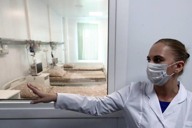 MOSCOW, RUSSIA - APRIL 23, 2020: Head of Infectious Disease department Kristina Ryabikova shows an in-patient ward at Demikhov city hospital No 68 for coronavirus patients; a new 800-bed infectious disease centre in the village of Voronovskoye was built within a month using pre-fabricated structures; after the COVID-19 pandemic, the centre will deal with all types of infectious diseases. Valery Sharifulin TASS  TS0D6C72