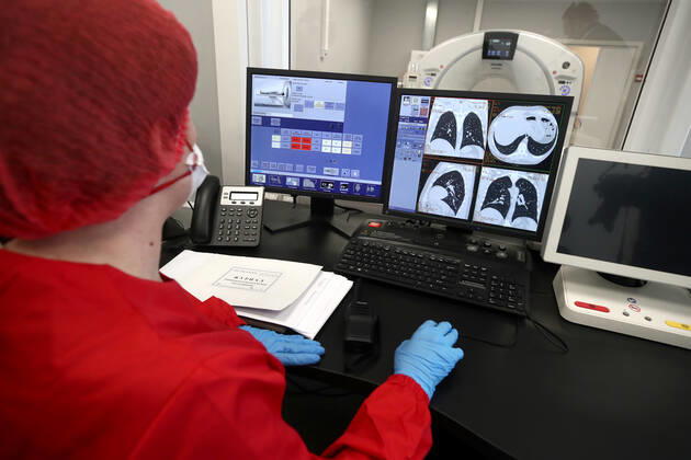 MOSCOW, RUSSIA - APRIL 23, 2020: A specialist of Diagnostic Radiology Department at work at Demikhov city hospital No 68 for coronavirus patients; a new 800-bed infectious disease centre in the village of Voronovskoye was built within a month using pre-fabricated structures; after the COVID-19 pandemic, the centre will deal with all types of infectious diseases. Valery Sharifulin TASS  TS0D6C98