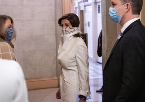 Speaker of the House Nancy Pelosi, D-Calif, wears a scarf as a mask to protect against COVID-19 as she arrives at the U.S. Capitol on Thursday, April 23, 2020. The House is expected to vote and pass a $500 billion Coronavirus relief bill that includes additional money for the small-business loan program, as well as for hospitals and testing.  WAP20200423306 KEVINxDIETSCH