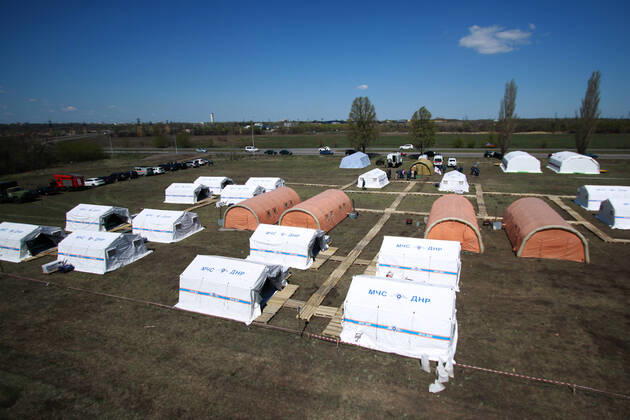 DONETSK, UKRAINE - APRIL 23, 2020: An aerial view of a field hospital for coronavirus patients set up by servicemen of the Emergency Situations Ministry of the Donetsk People s Republic as part of a COVID-19 response exercise; the exercise is aimed at providing a timely and efficient professional medical assistance to victims of emergencies in case of a lack of beds in hospitals. A similar field hospital can admit over 100 people. Valentin Sprinchak TASS  TS0D6D2D