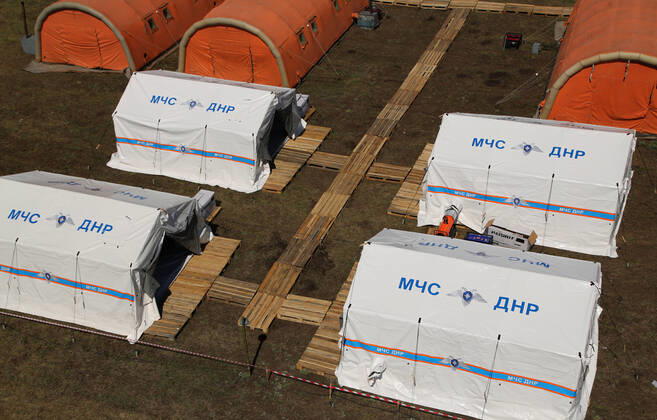 DONETSK, UKRAINE - APRIL 23, 2020: An aerial view of a field hospital for coronavirus patients set up by servicemen of the Emergency Situations Ministry of the Donetsk People s Republic as part of a COVID-19 response exercise; the exercise is aimed at providing a timely and efficient professional medical assistance to victims of emergencies in case of a lack of beds in hospitals. A similar field hospital can admit over 100 people. Valentin Sprinchak TASS  TS0D6D2F