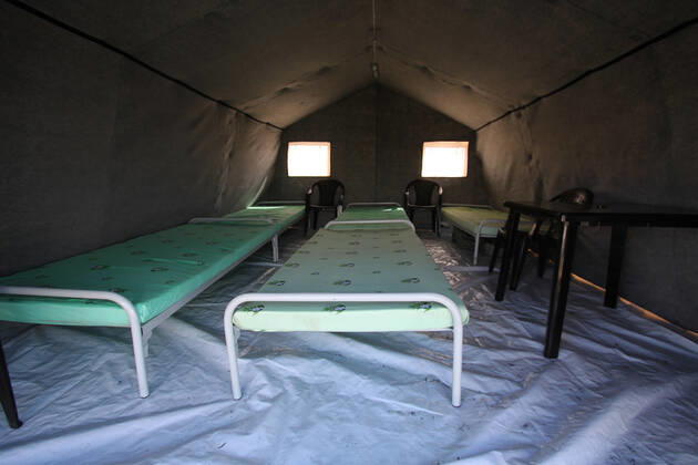 DONETSK, UKRAINE - APRIL 23, 2020: A tent interior at a field hospital for coronavirus patients set up by servicemen of the Emergency Situations Ministry of the Donetsk People s Republic as part of a COVID-19 response exercise; the exercise is aimed at providing a timely and efficient professional medical assistance to victims of emergencies in case of a lack of beds in hospitals. A similar field hospital can admit over 100 people. Valentin Sprinchak TASS  TS0D6D44