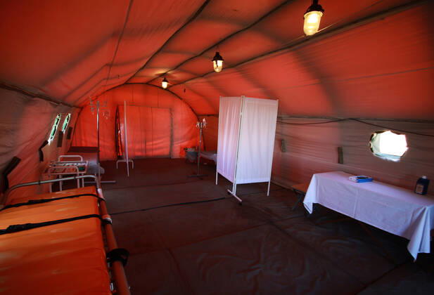 DONETSK, UKRAINE - APRIL 23, 2020: A tent interior at a field hospital for coronavirus patients set up by servicemen of the Emergency Situations Ministry of the Donetsk People s Republic as part of a COVID-19 response exercise; the exercise is aimed at providing a timely and efficient professional medical assistance to victims of emergencies in case of a lack of beds in hospitals. A similar field hospital can admit over 100 people. Valentin Sprinchak TASS  TS0D6D45