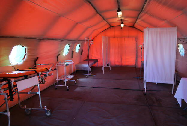 DONETSK, UKRAINE - APRIL 23, 2020: A tent interior at a field hospital for coronavirus patients set up by servicemen of the Emergency Situations Ministry of the Donetsk People s Republic as part of a COVID-19 response exercise; the exercise is aimed at providing a timely and efficient professional medical assistance to victims of emergencies in case of a lack of beds in hospitals. A similar field hospital can admit over 100 people. Valentin Sprinchak TASS  TS0D6D46