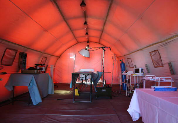 DONETSK, UKRAINE - APRIL 23, 2020: A tent interior at a field hospital for coronavirus patients set up by servicemen of the Emergency Situations Ministry of the Donetsk People s Republic as part of a COVID-19 response exercise; the exercise is aimed at providing a timely and efficient professional medical assistance to victims of emergencies in case of a lack of beds in hospitals. A similar field hospital can admit over 100 people. Valentin Sprinchak TASS  TS0D6D47