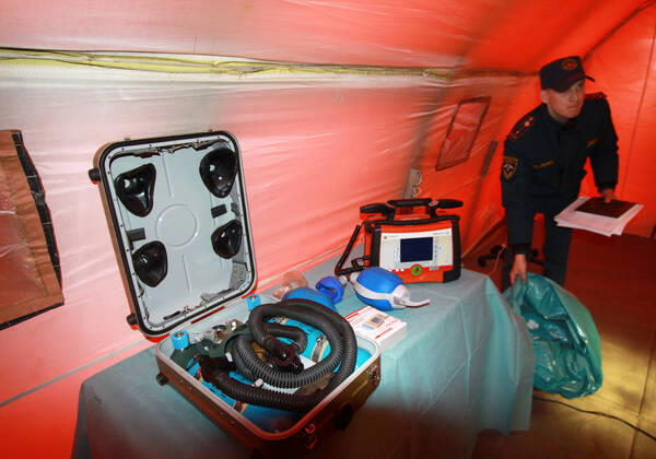 DONETSK, UKRAINE - APRIL 23, 2020: A serviceman of the Emergency Situations Ministry of the Donetsk People s Republic in a tent at a field hospital for coronavirus patients set up as part of a COVID-19 response exercise; the exercise is aimed at providing a timely and efficient professional medical assistance to victims of emergencies in case of a lack of beds in hospitals. A similar field hospital can admit over 100 people. Valentin Sprinchak TASS  TS0D6D41