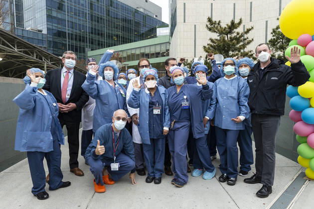 NYC Police Benevolent Association thanks staff CEO of Northwell Health Michael Dowling poses with nurses, doctors, staff during NYC Police Benevolent Association thanks staff at LIJMC. President of NYC Police Benevolent Association Patrick Lynch joins dozens of NYC police officers to address LIJMC staff to thank them for their heroic work in battling the COVID crisis and present staff with 750 individually-wrapped sandwiches, fruits and bottle of water. More than 7,000 patients were successfully treated and released from this hospital in the past few weeks. New Hyde Park New York United States Copyright: LevxRadin