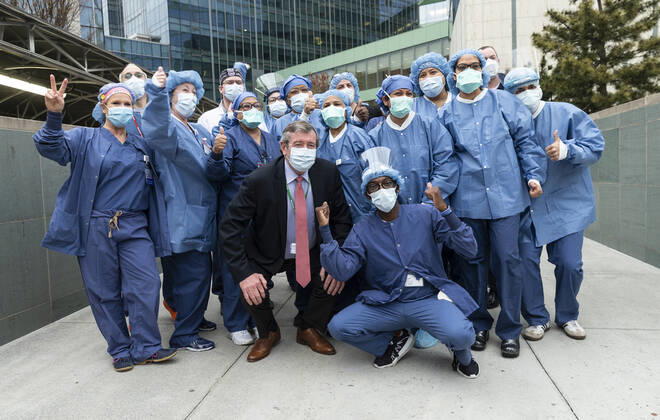 NYC Police Benevolent Association thanks staff CEO of Northwell Health Michael Dowling poses with nurses, doctors, staff during NYC Police Benevolent Association thanks staff at LIJMC. President of NYC Police Benevolent Association Patrick Lynch joins dozens of NYC police officers to address LIJMC staff to thank them for their heroic work in battling the COVID crisis and present staff with 750 individually-wrapped sandwiches, fruits and bottle of water. More than 7,000 patients were successfully treated and released from this hospital in the past few weeks. New Hyde Park New York United States Copyright: LevxRadin