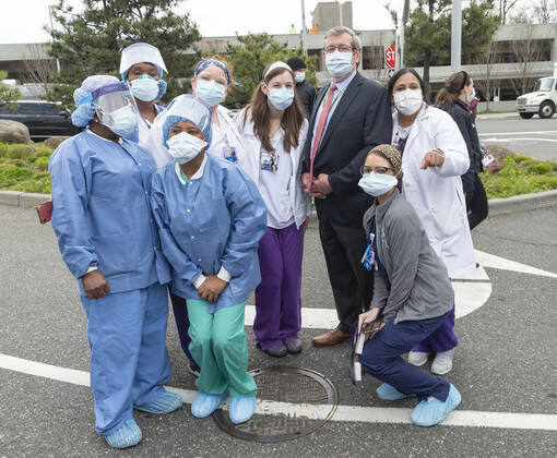 NYC Police Benevolent Association thanks staff CEO of Northwell Health Michael Dowling poses with nurses, doctors and staff during NYC Police Benevolent Association thanks staff at LIJMC. President of NYC Police Benevolent Association Patrick Lynch joins dozens of NYC police officers to address LIJMC staff to thank them for their heroic work in battling the COVID crisis and present staff with 750 individually-wrapped sandwiches, fruits and bottle of water. More than 7,000 patients were successfully treated and released from this hospital in the past few weeks. New Hyde Park New York United States Copyright: LevxRadin