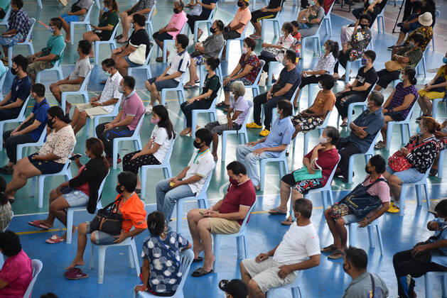 April 23, 2020, Bangkok, Thailand: People seat at a social distance as they wait for items during the event..Wat Rakhang Khositaram a Thai monk monastery gives to the general public and medical staff of Siriraj Hospital. Due to the shutdown following the Covid-19 outbreak, many people are living without income and economically affected. Bangkok Thailand - ZUMAs197 20200423_zaa_s197_097 Copyright: xYuttachaixKongprasertx