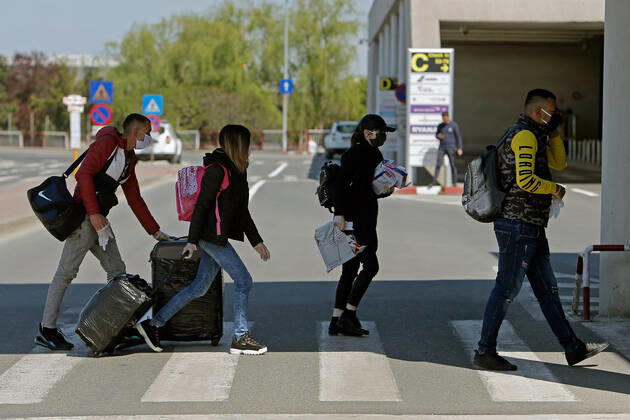 (200423) -- BUCHAREST, April 23, 2020 (Xinhua) -- Seasonal workers from Romania to United Kingdom for agricultural harvest arrive to take their departure flight amid COVID-19 pandemic at the Henri Coanda International Airport near Bucharest, Romania, on April 23, 2020. Romania has reported 386 new COVID-19 cases in the past 24 hours, bringing the total number of confirmed cases to 10,096, local authorities said on Thursday. (Photo by Cristian Cristel Xinhua) ROMANIA-BUCHAREST-COVID-19-SEASONAL WORKERS 