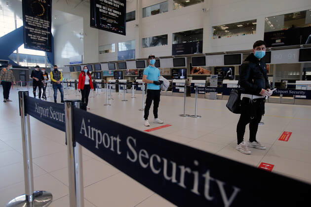 (200423) -- BUCHAREST, April 23, 2020 (Xinhua) -- Seasonal workers from Romania to the United Kingdom for agricultural harvest line up for their departure flight amid COVID-19 pandemic at the Henri Coanda International Airport near Bucharest, Romania, on April 23, 2020. Romania has reported 386 new COVID-19 cases in the past 24 hours, bringing the total number of confirmed cases to 10,096, local authorities said on Thursday. (Photo by Cristian Cristel Xinhua) ROMANIA-BUCHAREST-COVID-19-SEASONAL WORKERS 