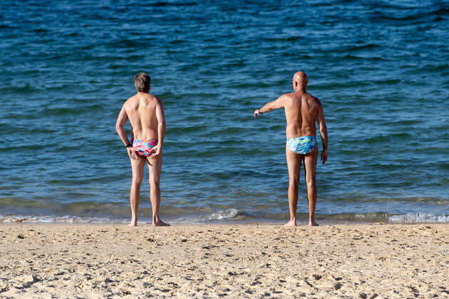 SYDNEY, AUSTRALIA - APRIL 23: Two men about to exercise allowing 1.5m between themselves on Balmoral beach due to COVID 19 on 23 April, 2020 in Sydney, Australia. (Photo by Speed Media Icon Sportswire)