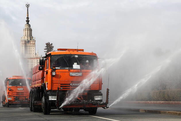 MOSCOW, RUSSIA - APRIL 24, 2020: Street cleaning trucks wash with disinfectant roads in Moscow s Vorobyovy Gory Sparrow Hills amid the ongoing COVID-19 pandemic. Anton Novoderezhkin TASS  TS0D6E17