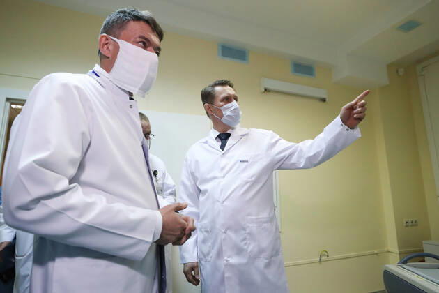 MOSCOW, RUSSIA - APRIL 24, 2020: Andrei Kaprin (L), General Director of the Russian National Medical Research Centre of Radiology, and Russia s Healthcare Minister Mikhail Murashko visit a department of infectious diseases opened at Lopatkin Urology and Interventional Radiology Research Institute to treat COVI-19 patients. Sergei Savostyanov TASS  TS0D6F53