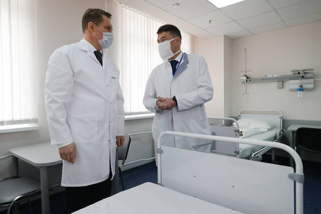 MOSCOW, RUSSIA - APRIL 24, 2020: Russia s Healthcare Minister Mikhail Murashko (L) and Andrei Kaprin, General Director of the Russian National Medical Research Centre of Radiology, visit a department of infectious diseases opened at Lopatkin Urology and Interventional Radiology Research Institute to treat COVI-19 patients. Sergei Savostyanov TASS  TS0D6F5B