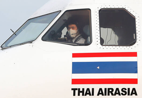 April 24, 2020, Bangkok, Thailand: A pilot wears a face mask as a preventive measure against the spread of Coronavirus at Don Mueang International Airport..Thailand has so far reported 2,854 cases of COVID-19 coronavirus with most of the cases reported in the Capital city of Bangkok. Bangkok Thailand - ZUMAs197 20200424_zaa_s197_055 Copyright: xChaiwatxSubprasomx