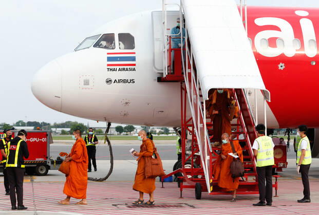 April 24, 2020, Bangkok, Thailand: Buddhist monks wearing face masks as a preventive measure arrive at Don Mueang International Airport during the Coronavirus (COVID-19) crisis..Thailand has so far reported 2,854 cases of COVID-19 coronavirus with most of the cases reported in the Capital city of Bangkok. Bangkok Thailand - ZUMAs197 20200424_zaa_s197_058 Copyright: xChaiwatxSubprasomx