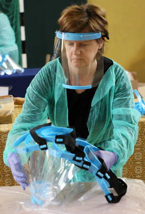 Members of the City Hall and volunteers produce face shields in one of the primary schools durng the coronavirus outbreak Members of the City Hall and volunteers produce face shields in one of the primary schools durng the coronavirus outbreak on April 24, 2020 in Otwock near Warsaw, Poland. EN_01426132_0011 