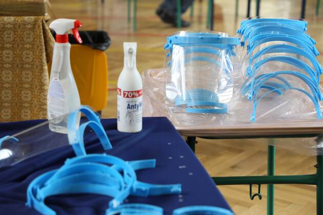 Members of the City Hall and volunteers produce face shields in one of the primary schools durng the coronavirus outbreak Members of the City Hall and volunteers produce face shields in one of the primary schools durng the coronavirus outbreak on April 24, 2020 in Otwock near Warsaw, Poland. EN_01426153_0002 
