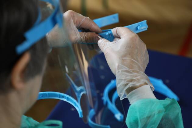 Members of the City Hall and volunteers produce face shields in one of the primary schools durng the coronavirus outbreak Members of the City Hall and volunteers produce face shields in one of the primary schools durng the coronavirus outbreak on April 24, 2020 in Otwock near Warsaw, Poland. EN_01426153_0009 
