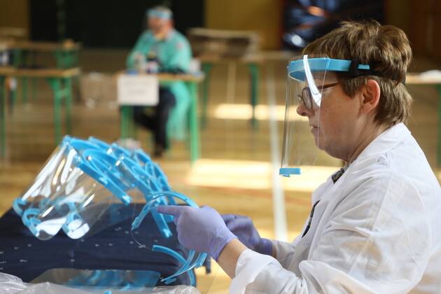 Members of the City Hall and volunteers produce face shields in one of the primary schools durng the coronavirus outbreak Members of the City Hall and volunteers produce face shields in one of the primary schools durng the coronavirus outbreak on April 24, 2020 in Otwock near Warsaw, Poland. EN_01426153_0011 