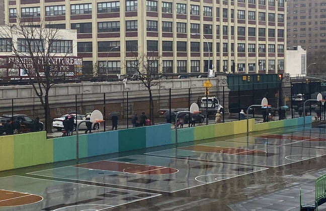 NEW YORK, NY- APRIL 24: New Yorkers line up in the Rain at food distribution point with paper bags donated by Staples at Roberto Clemente School during the coronavirus pandemic in West Harlem on April 24, 2020 in New York City. Copyright: xRainmakerxPhotos MediaPunchx