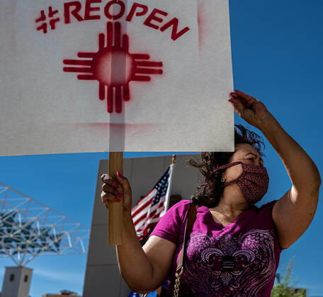 April 24, 2020, Albuquerque, New Mexico, USA: April 24, 2020 Lupe Conley, 60, a retired worker, is one of the dozens of protestors near Civic Plaza in downtown Albuquerque to demand government officials to re-open businesses deemed nonessential. Albuquerque USA - ZUMAab1_ 20200424_zaf_ab1_002 Copyright: xAnthonyxJacksonx